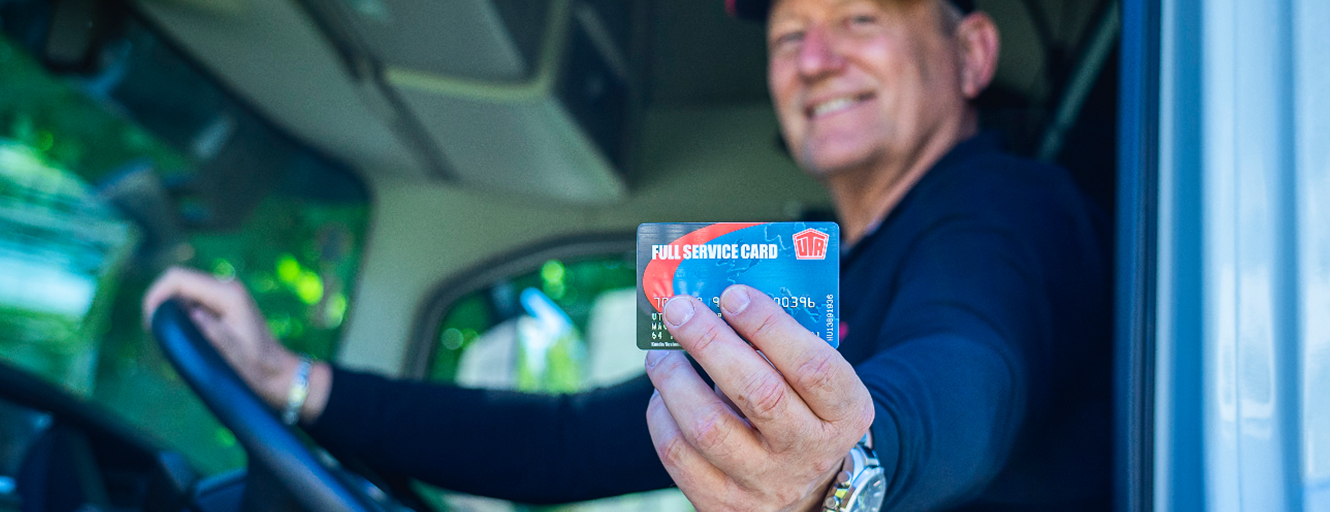 Driver holding UTA Full Service card