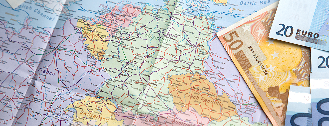 World map and Euro banknotes