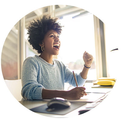 Woman cheerfully smiling at desk