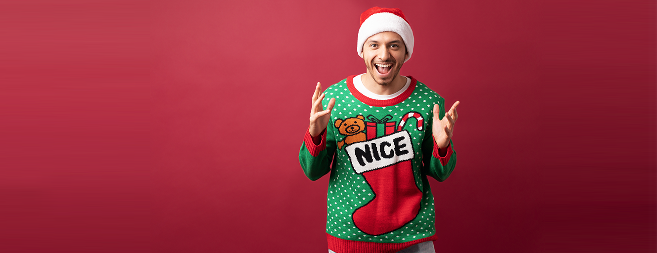 Man smiling in Christmas jumper